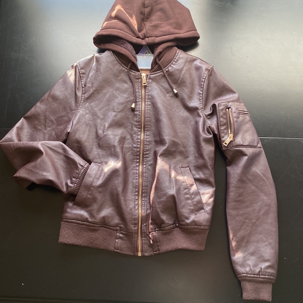 Selling a small leather jacket, with a hoodie and pockets
